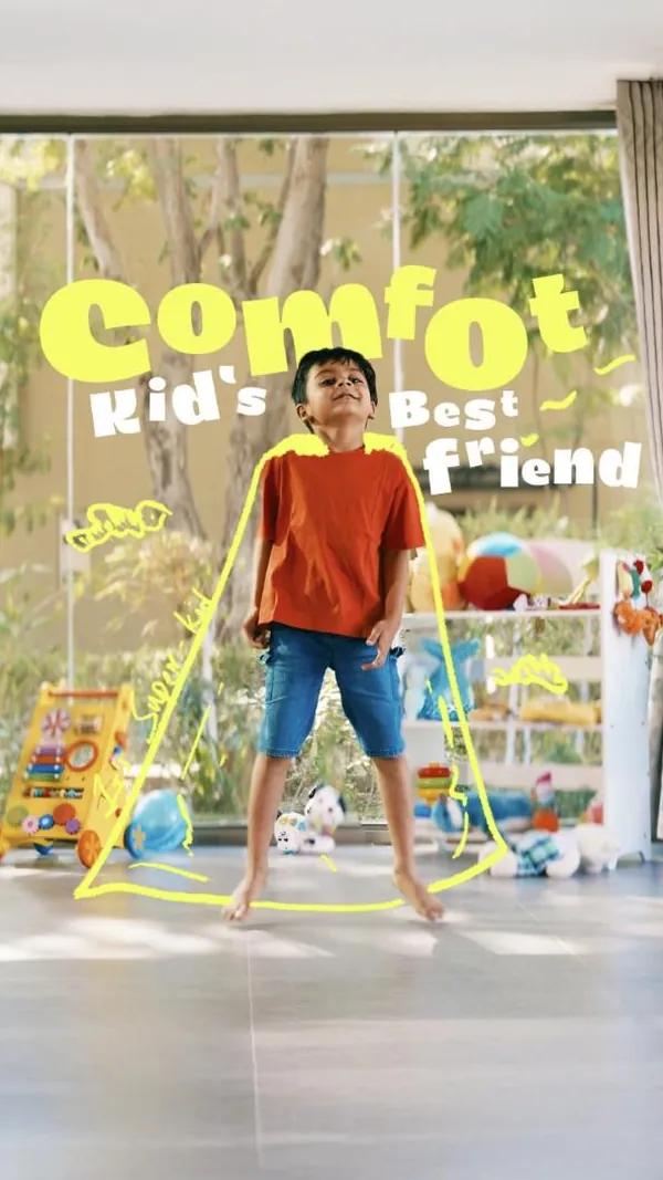Comfort as a kid’s best friend: a boy bounces around a sunny playroom.