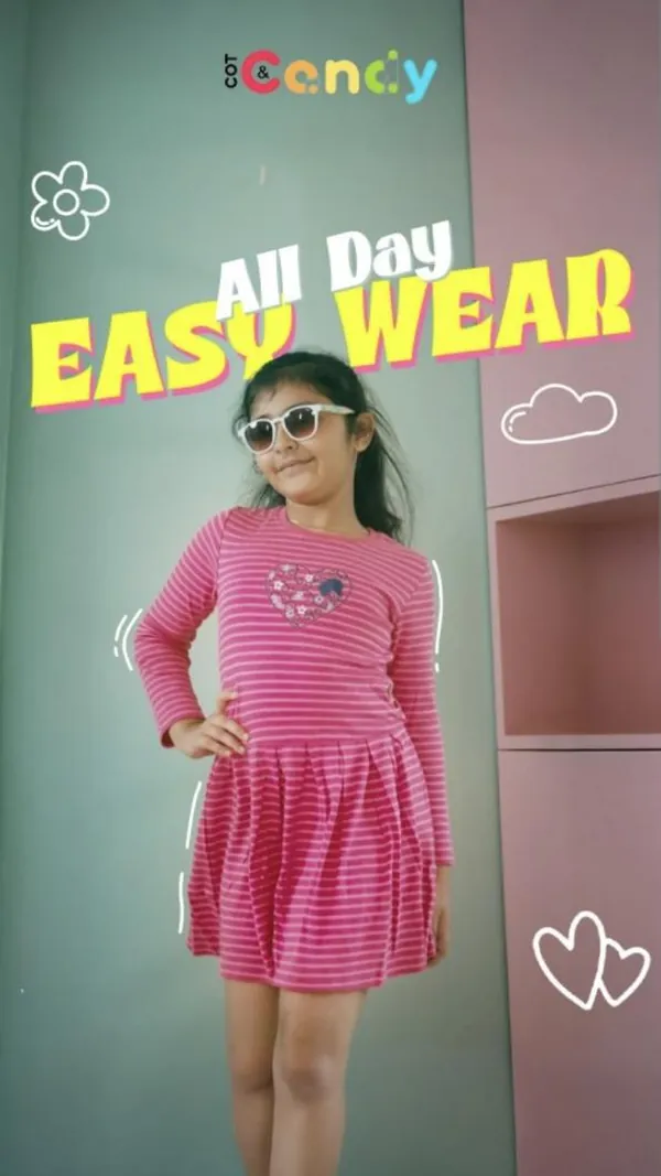 All-day easy wear: a girl in a pink striped dress and sunglasses, ready for playdates.