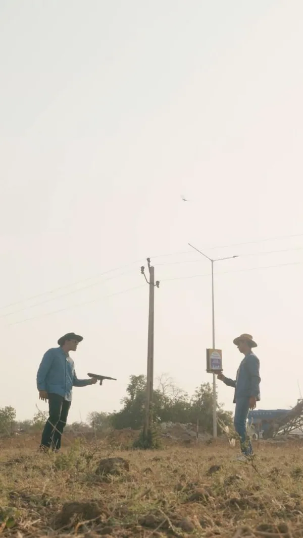 April Fools' cowboy duel: a western stand-off in an open field, staged as a contest.