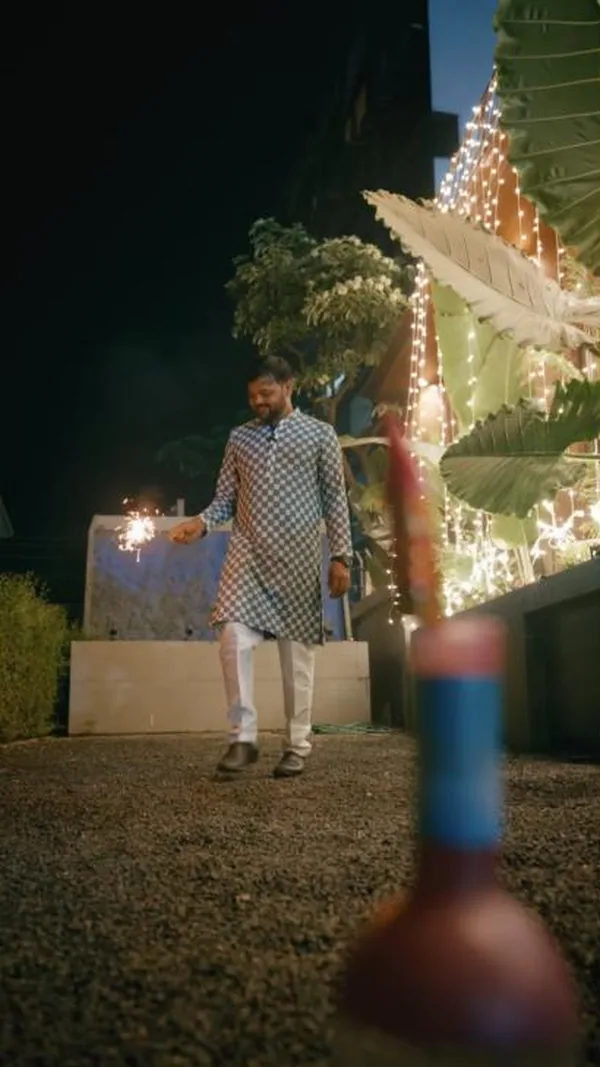 Diwali film: sparklers, fairy lights and family in the Toritos garden.