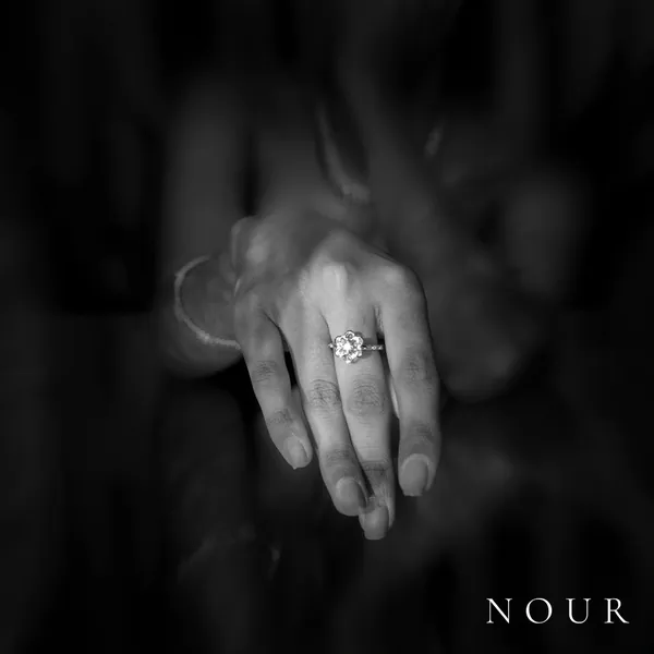 A solitaire ring held out of the shadows: the first post of the launch grid.