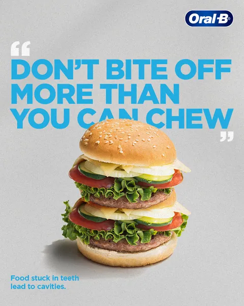 A towering double burger warns 'Don't bite off more than you can chew'.
