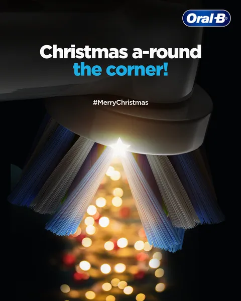 'Christmas a-round the corner!' Splayed brush bristles form a twinkling, star-topped tree.