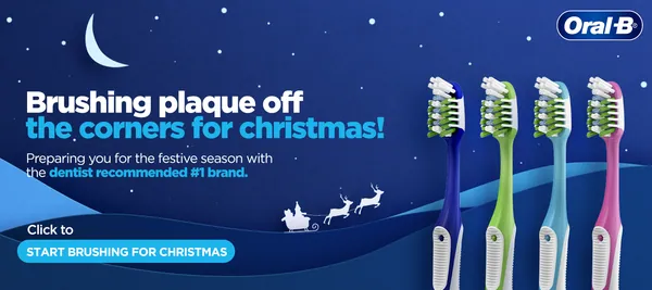 Four manual brushes under a crescent moon and Santa's sleigh, brushing plaque off for Christmas.