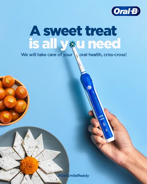 Diwali sweets meet a blue electric brush in hand: 'A sweet treat is all you need'.