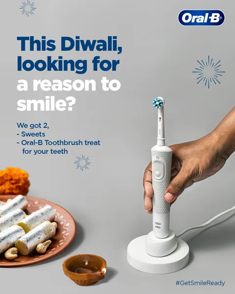 Grey Diwali variant: kaju katli and a diya beside a white electric brush, 'We got 2'.
