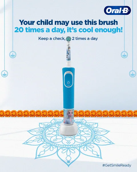 Diwali rangoli and marigolds frame a Frozen kids' brush: 'Keep a check, 2 times a day'.