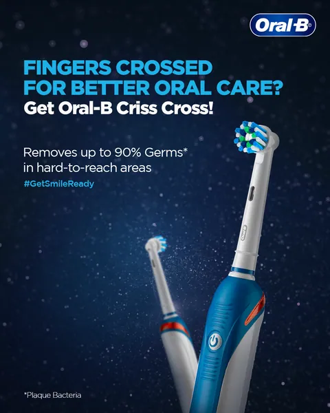 'Fingers crossed for better oral care?' Two electric brushes cross like fingers for Criss Cross.