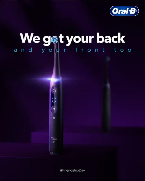 Friendship Day: a purple-lit iO with a second brush behind, 'We got your back'.