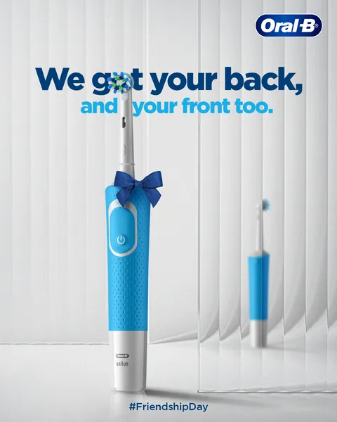 Gift-wrapped with a blue bow, an electric brush says 'We got your back' for Friendship Day.