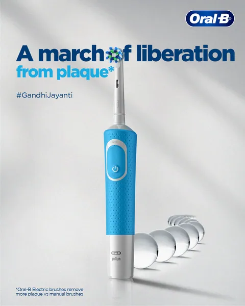Gandhi Jayanti: a blue electric brush leads a line of glass beads, 'A march of liberation'.