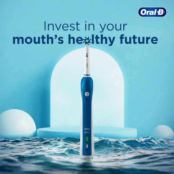 'Invest in your mouth's healthy future': a blue electric brush standing in sea waves.