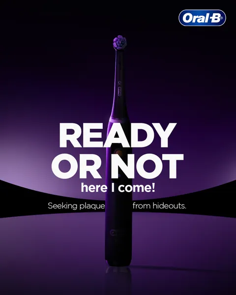 'Ready or not here I come!' A dark electric brush in purple light hunts hidden plaque.