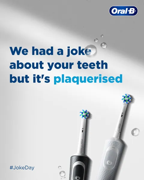Joke Day post with a plaque pun, 'but it's plaquerised', beside two electric brushes.