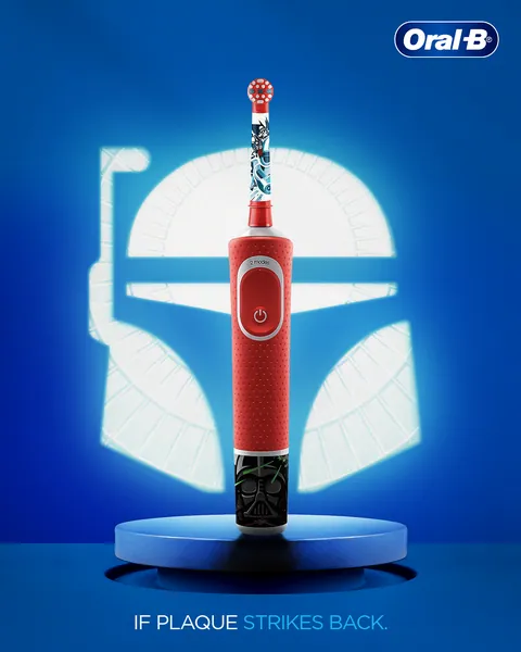 Kids' carousel opener: a Star Wars brush before a glowing helmet, 'If plaque strikes back'.