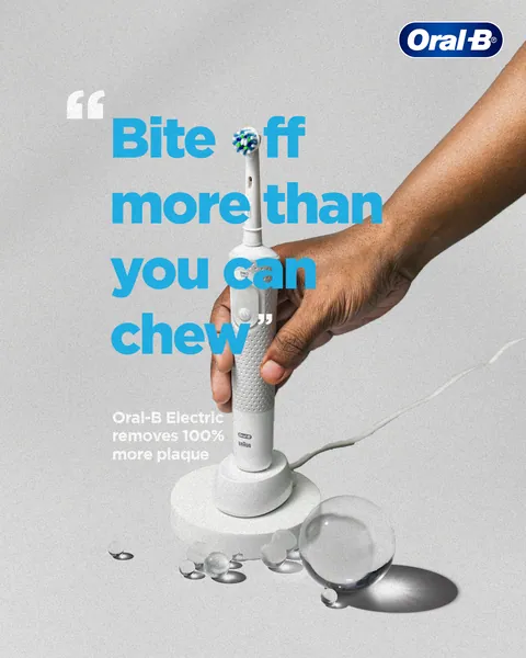 A hand grips a white electric brush, its head forming the 'o' in 'Bite off'.