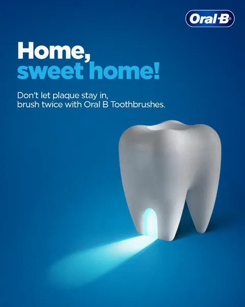 A lit doorway in a giant tooth spins 'Home, sweet home!' into a plaque warning.