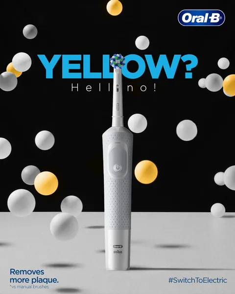 'Yellow? Hello no!' A white electric brush stands among floating white and yellow spheres.