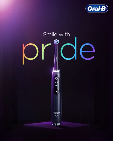 Pride Month: an iO brush dots the 'i' of a rainbow 'Smile with pride'.