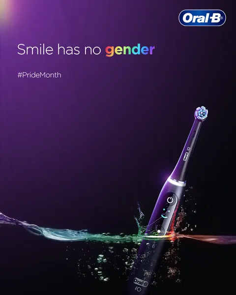 A purple electric brush splashes through rainbow-lit water for Pride Month: 'Smile has no gender'.