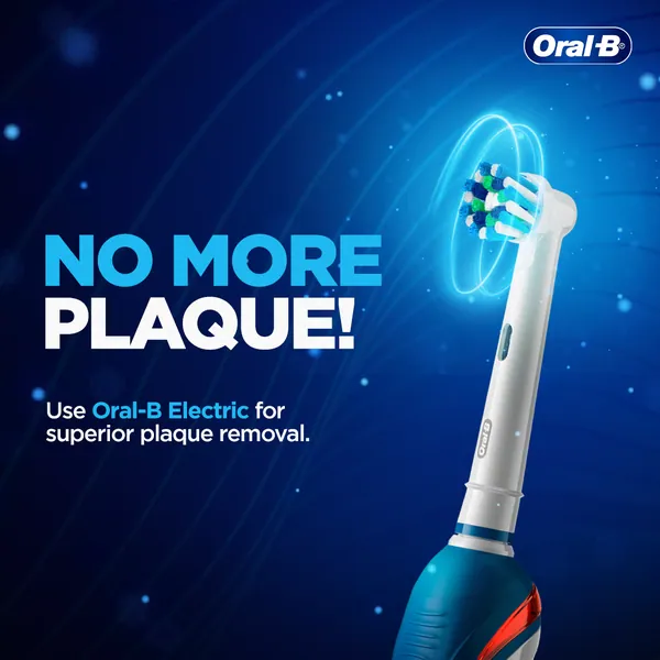 'No more plaque!' Glowing rings circle a spinning electric brush head against deep blue.