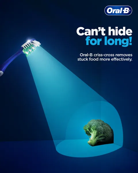 Spotlight gag: a criss-cross manual brush beams light onto a hiding broccoli floret.