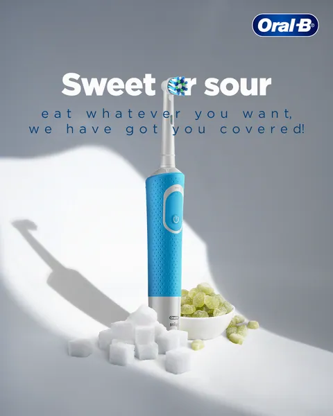 Sugar cubes and sour jellies sit by a blue electric brush: 'Sweet or sour'.