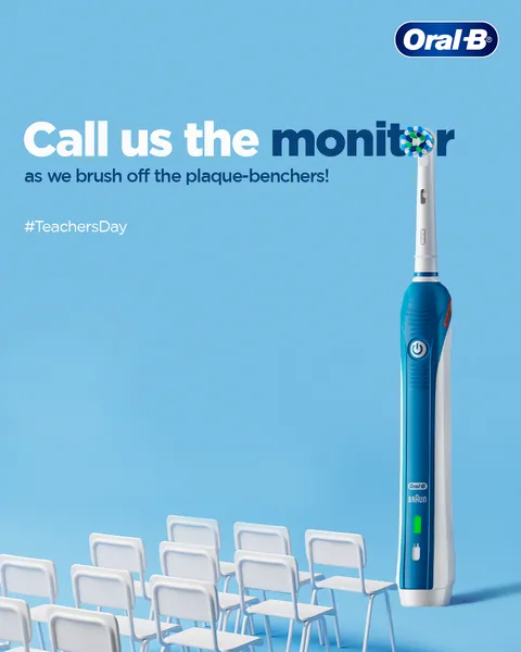 Teachers' Day: a blue electric brush faces rows of chairs, 'Call us the monitor'.