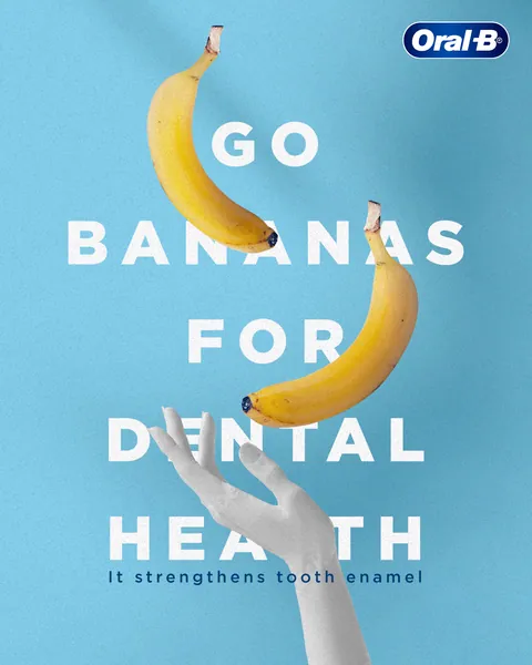 Floating bananas and a white sculpted hand spell out 'Go bananas for dental health'.
