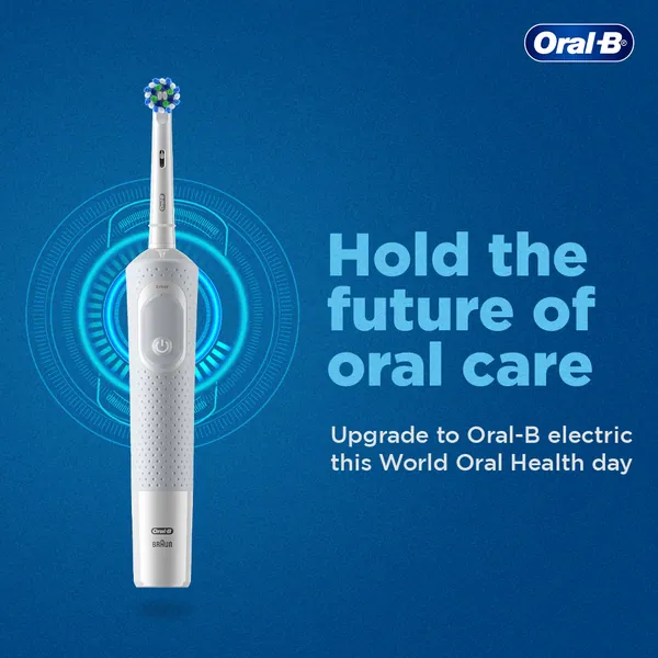 World Oral Health Day: a white brush against tech rings, 'Hold the future of oral care'.