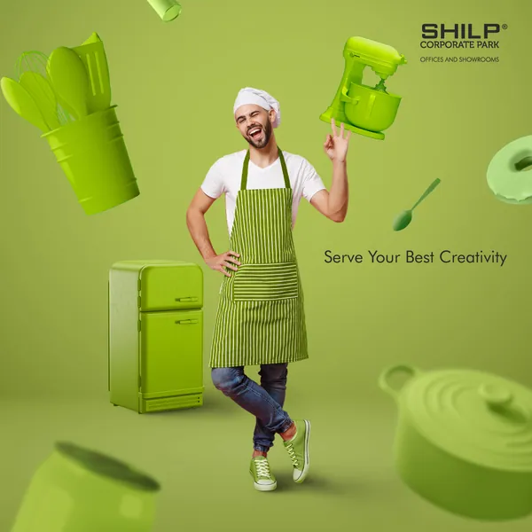 Winking chef surrounded by floating lime-green kitchenware for Shilp Corporate Park, 'Serve your best creativity'.