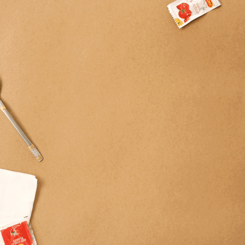 A veggie pizza appears on the table in stop-motion, then vanishes slice by slice.