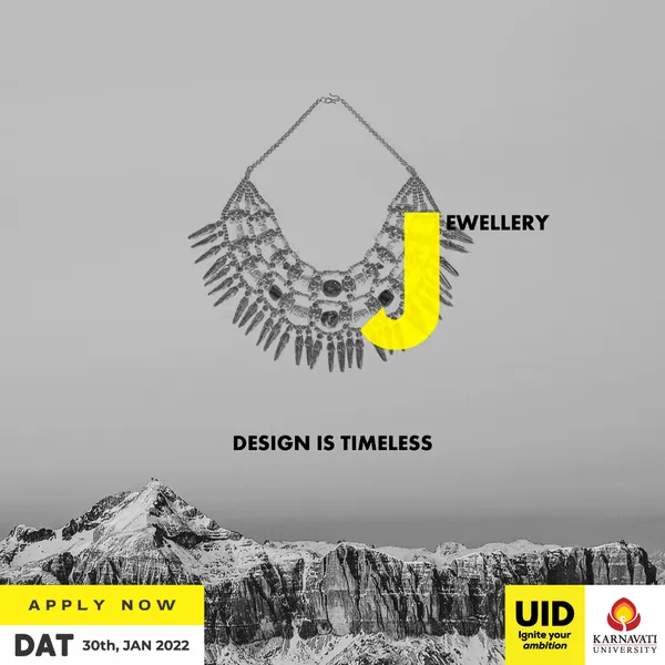 Part four, jewellery: a statement necklace with a yellow J above a snowy mountain range.