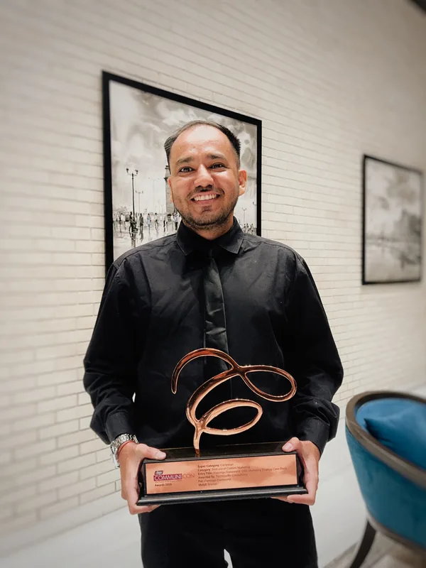Karan Pawar holding the Bronze trophy